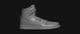 the white leather sneaker on a black background